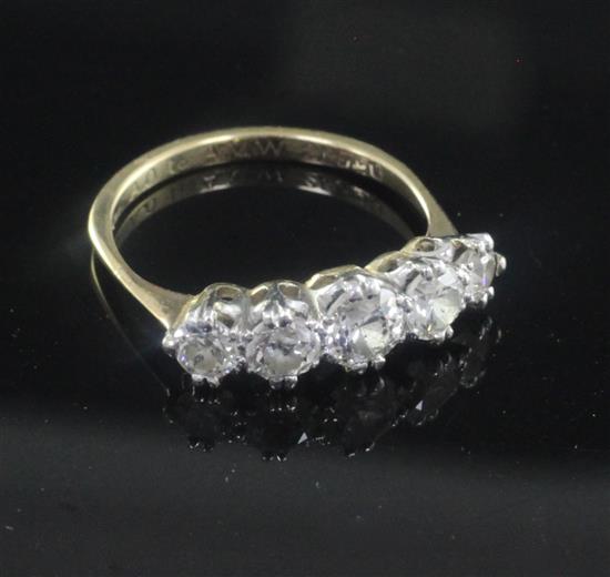 A mid 20th century gold and graduated five stone diamond ring, size N.